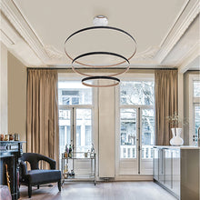 Load image into Gallery viewer, Verdura LED Multi Tier Chandelier in living room.
