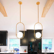 Load image into Gallery viewer, Everley Pendant Light in dining room.
