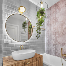 Load image into Gallery viewer, Everley Wall Light in bathroom.
