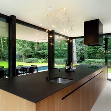 Load image into Gallery viewer, Flock of Light LED Chandelier in dining room.
