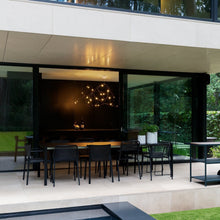 Load image into Gallery viewer, Flock of Light LED Chandelier in dining room.
