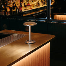 Load image into Gallery viewer, Gustave LED Table Lamp in restaurant.
