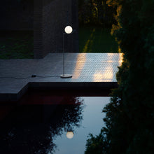 Load image into Gallery viewer, IC Lights Outdoor LED Floor Lamp in Outsite Area.

