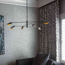 Load image into Gallery viewer, Bowery LED Chandelier in living room.
