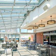 Load image into Gallery viewer, Fiona Drum Pendant Light in restaurant.
