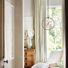 Load image into Gallery viewer, Styx LED Pendant Light in living room.
