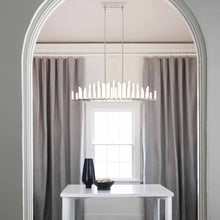 Load image into Gallery viewer, Trinity LED Linear Pendant Light in living room.
