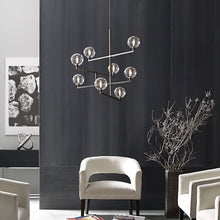 Load image into Gallery viewer, Gambit Chandelier in living room.

