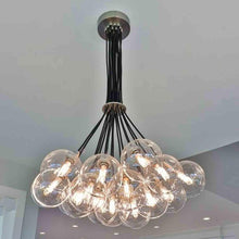 Load image into Gallery viewer, Gambit Multi Light Chandelier in dining room.
