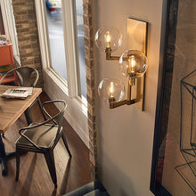 Load image into Gallery viewer, Gambit Wall Light in dining room.
