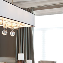 Load image into Gallery viewer, Gresham Park Linear Pendant Light in living room.
