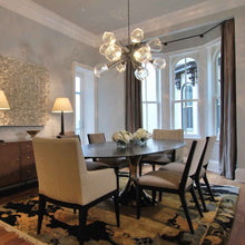 Load image into Gallery viewer, Gem Oval Starburst LED Chandelier in living Room.
