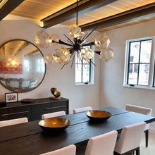 Load image into Gallery viewer, Gem Oval Starburst LED Chandelier in dining Room.
