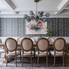 Load image into Gallery viewer, Gem Oval Starburst LED Chandelier in dining Room.
