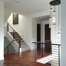 Load image into Gallery viewer, Ledgestone Round LED Multi Light Pendant Light in living room.
