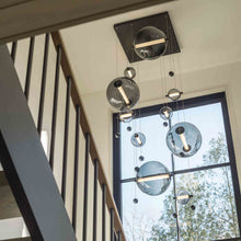Load image into Gallery viewer, Abacus LED Pendant Light in living room.
