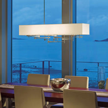 Load image into Gallery viewer, Cavaletti Pendant Light in dining room.
