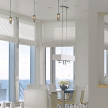 Load image into Gallery viewer, Cavaletti Pendant Light in dining room.
