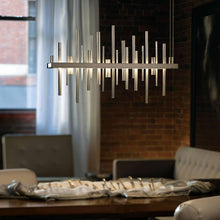 Load image into Gallery viewer, Cityscape LED Pendant Light in living room.
