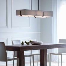 Load image into Gallery viewer, Exos Long Rectangular Pendant Light in dining room.
