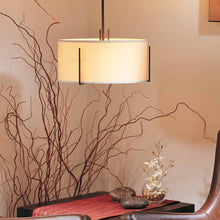 Load image into Gallery viewer, Exos Single Shade Pendant Light in living room.
