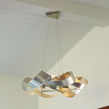 Load image into Gallery viewer, Flux LED Pendant Light in living room.
