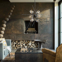 Load image into Gallery viewer, Griffin Starburst Pendant Light in living room.
