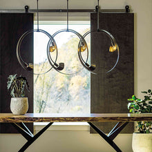 Load image into Gallery viewer, Orion Linear Pendant Light in living room.
