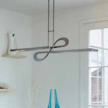 Load image into Gallery viewer, Switchback LED Pendant Light in dinning room.
