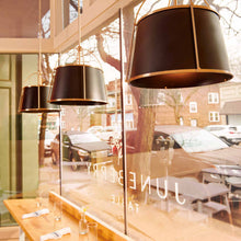 Load image into Gallery viewer, Clarke Drum Pendant Light in restaurant.
