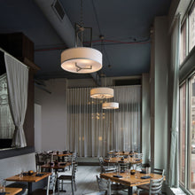 Load image into Gallery viewer, Hampton Drum Pendant Light in Restaurant.
