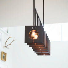 Load image into Gallery viewer, Ludlow Linear Pendant Light in living room.
