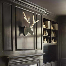 Load image into Gallery viewer, Stag Wall Light in living room.
