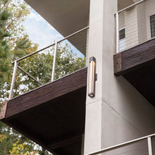 Load image into Gallery viewer, Vapor Outdoor Wall Light in Outside Area.
