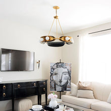 Load image into Gallery viewer, Hopper Chandelier in living room.
