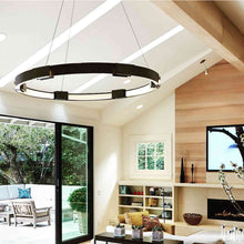 Load image into Gallery viewer, Aura LED Pendant Light in living room.
