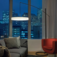 Load image into Gallery viewer, Disq Arc LED Floor Lamp in living room.
