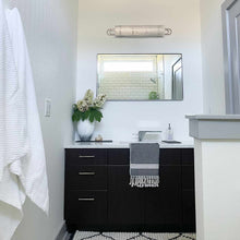 Load image into Gallery viewer, Buckley Bath Vanity Light in bathroom.
