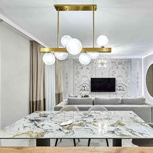 Load image into Gallery viewer, Hinsdale Linear Pendant Light in living room.
