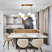Load image into Gallery viewer, Hinsdale Linear Pendant Light in living room.
