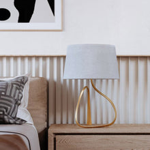 Load image into Gallery viewer, Tharold Table Lamp in bedroom.

