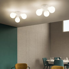 Load image into Gallery viewer, Atomium Wall Light in restaurant.
