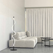 Load image into Gallery viewer, Cursive LED Floor Lamp in living room.
