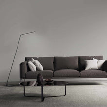 Load image into Gallery viewer, Miter LED Floor Lamp in living room.
