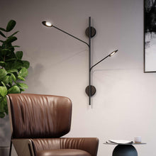 Load image into Gallery viewer, Rotaire LED Adjustable Wall Light in living room.
