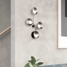 Load image into Gallery viewer, Rotaire LED Wall Light in living room.
