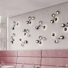Load image into Gallery viewer, Rotaire LED Wall Light in living room.
