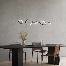 Load image into Gallery viewer, Serif LED Linear Pendant Light in living room.
