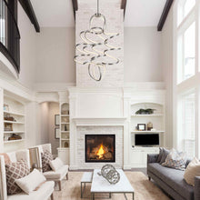 Load image into Gallery viewer, Synergy Vertical LED Pendant Light in living room.
