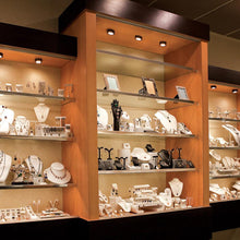 Load image into Gallery viewer, LEDme Round LED Button Light in display cabinet.
